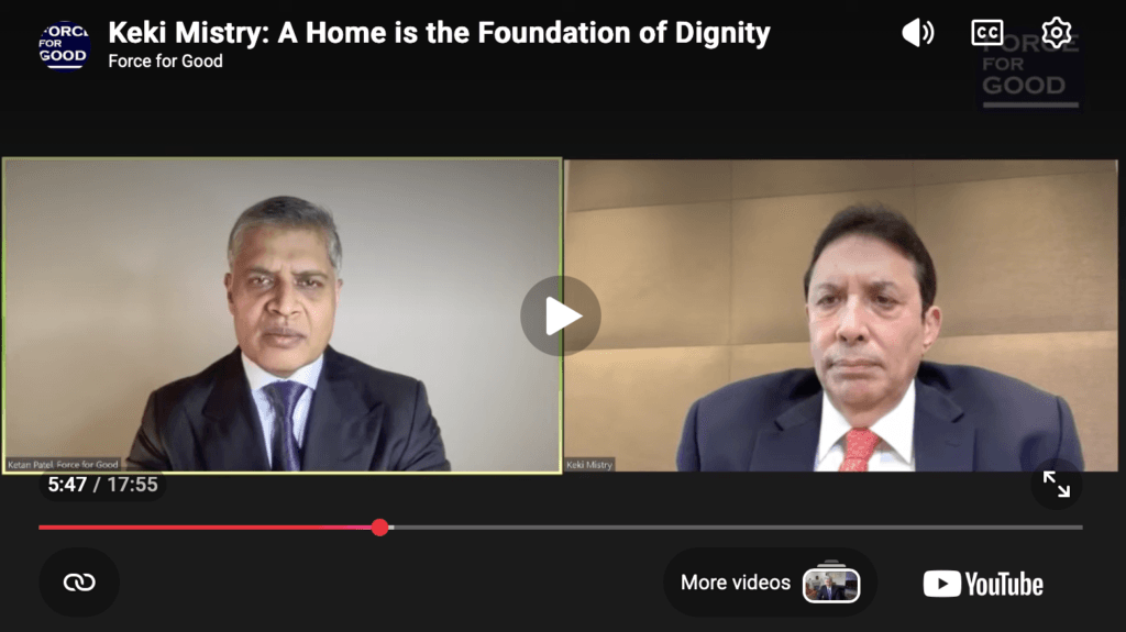 Screenshot of a paused YouTube video titled Keki Mistry: A Home is the Foundation of Dignity. Two men in suits appear on a split-screen video call, discussing how Keki Mistry is a force for good, with the progress bar at 5:47 of 17:55. | esgnews.com