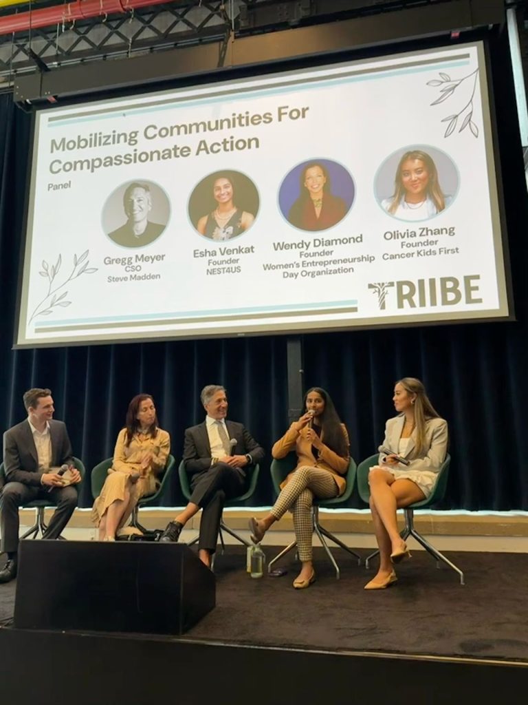 Kyle Matthys founder of Triibe on panel session on stage with guests