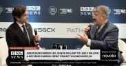 ESG News studio with host Matt Bird and guest Joseph Pallant sitting in front of Climate Week NYC backdrop.